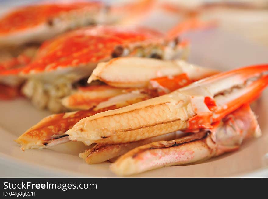 Boiled crab peeled-claw on plate. Boiled crab peeled-claw on plate