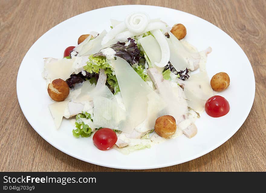 Salad with vegetables, meat and cheese