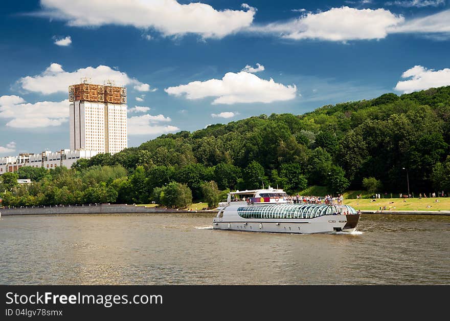 Tourist boat floats on the Moskva River in Moscow