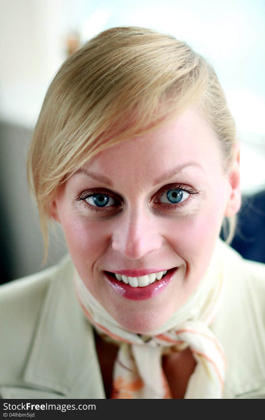 Image of a close-up portrait of young air hostess. Image of a close-up portrait of young air hostess