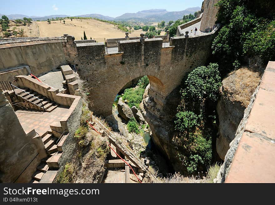 Roman bridge in Ronda, one of the famous white villages in Málaga, Andalusia, Spain. Roman bridge in Ronda, one of the famous white villages in Málaga, Andalusia, Spain