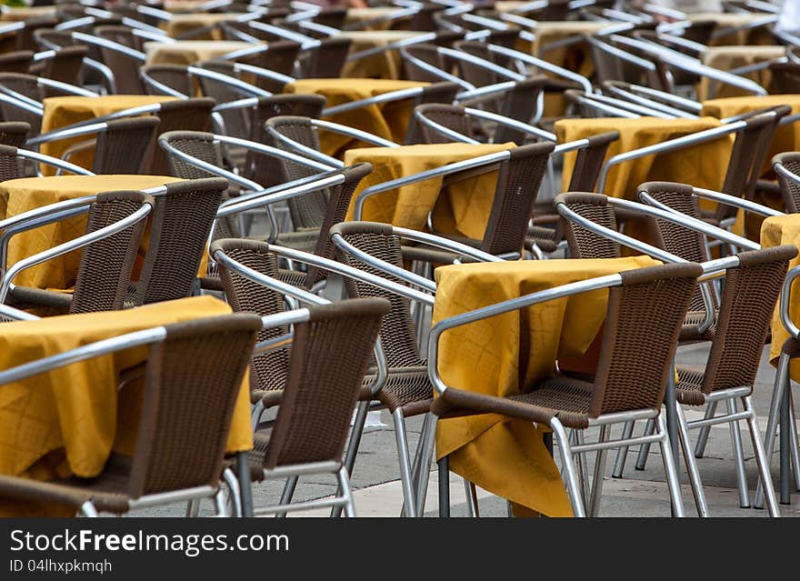 Image of a empty yellow terrace in a city street. Image of a empty yellow terrace in a city street.