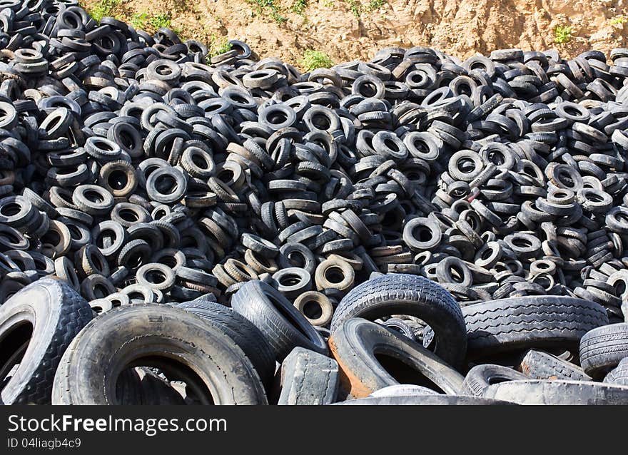 Heap of old Tires in recycling plant in Thailand. Heap of old Tires in recycling plant in Thailand