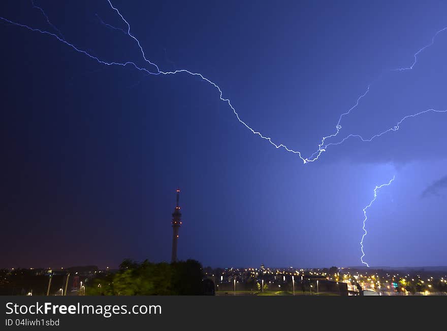 Horizontal and vertical lightning near telecommunications tower. Horizontal and vertical lightning near telecommunications tower