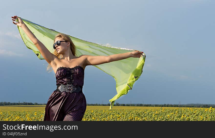 Woman with scarf in the countryside