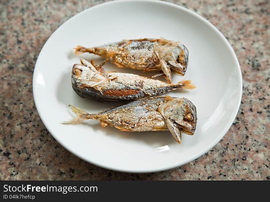 FRIED MACKEREL ON THE WHITE PLATE