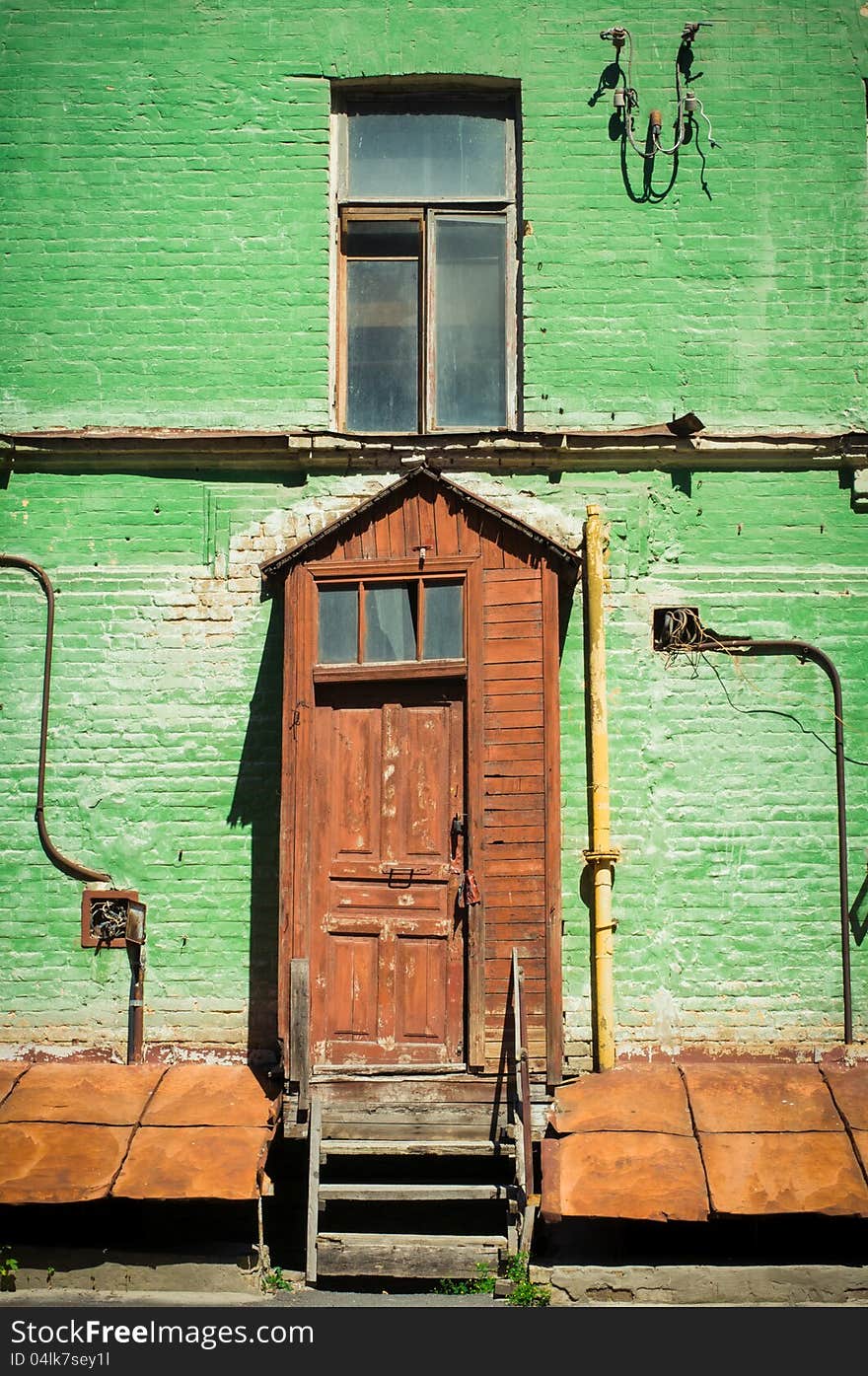 Old painted  brick house with window and door, Kyiv, Ukraine. Old painted  brick house with window and door, Kyiv, Ukraine