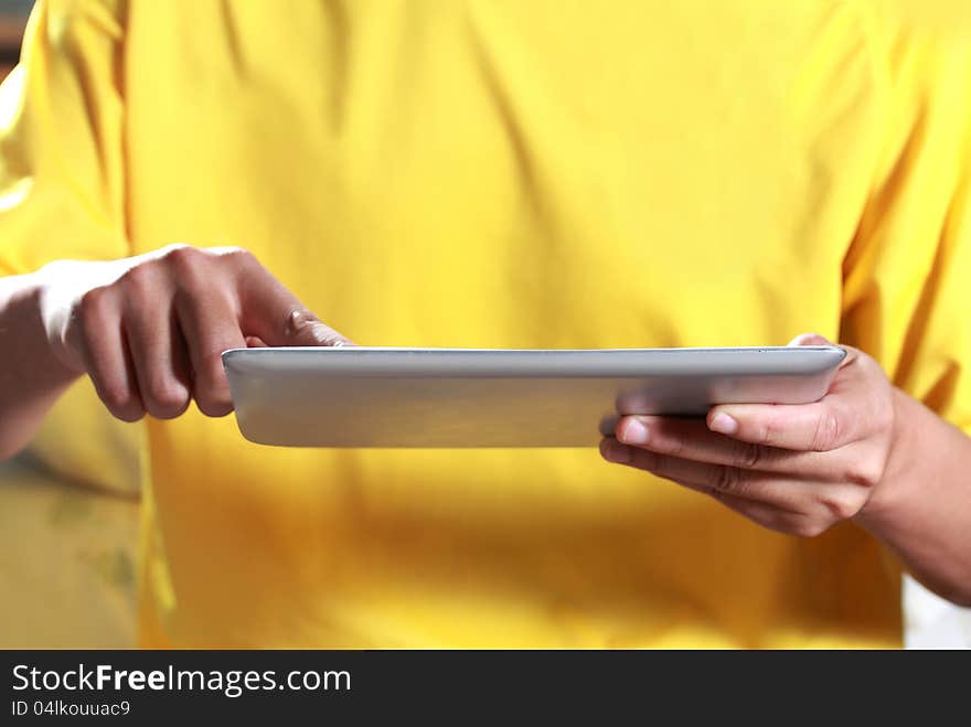 Man using digital tablet On the bed