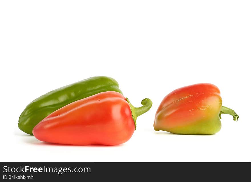 Close-up of fresh bell peppers on white background.