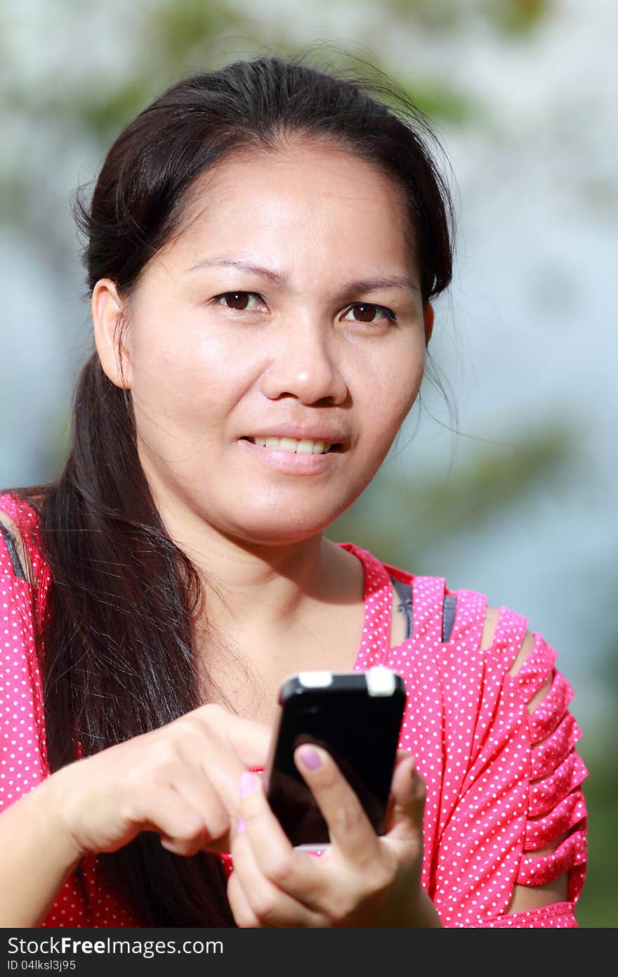 Women using smartphone In the park