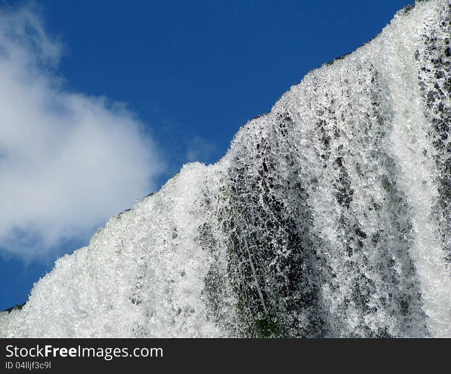 Beautiful stream of falling water and blue sky