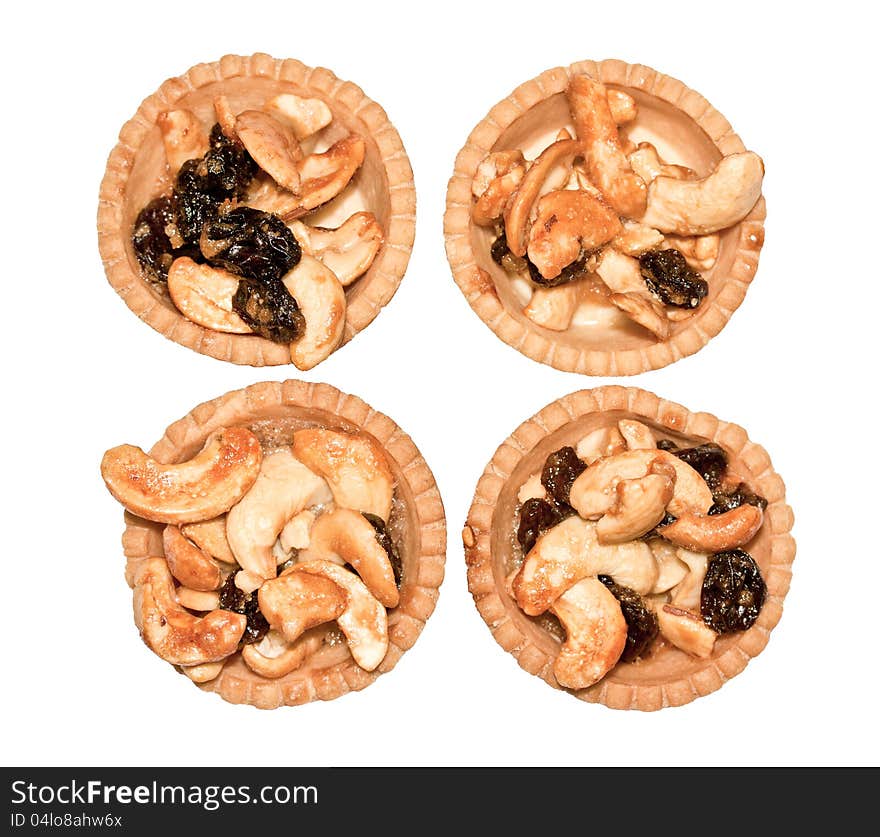 Four cashew tart on white background