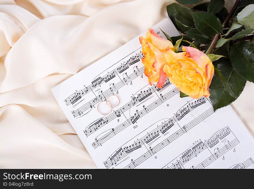 Bouquet of Roses, stave and wedding rings on Silk. Bouquet of Roses, stave and wedding rings on Silk