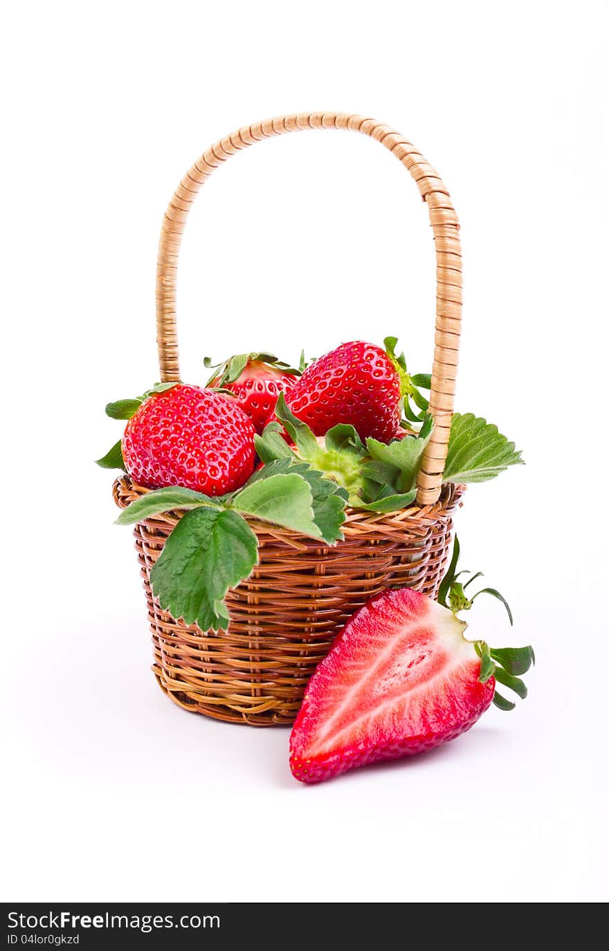 Fresh strawberries in the basket on white background