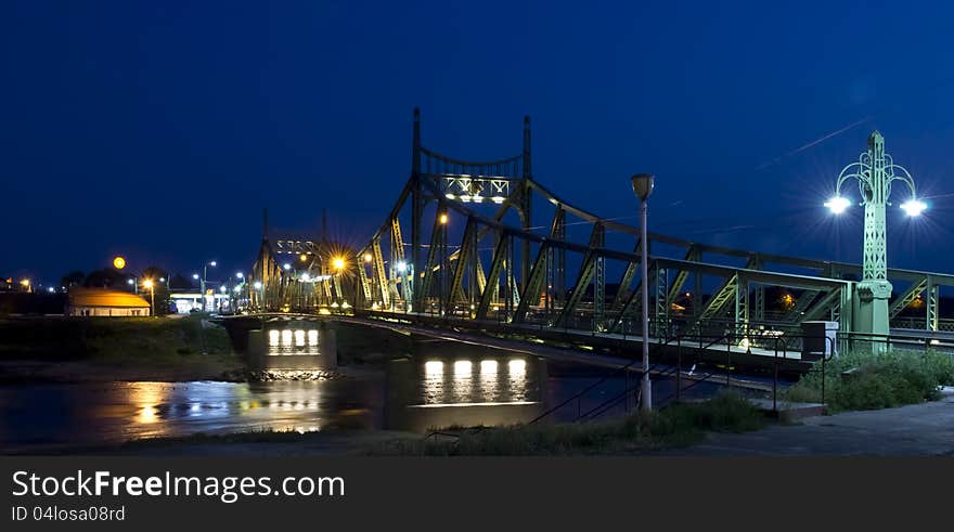 Bridge in Arad illuminated at night.