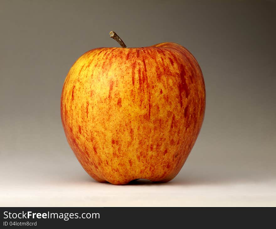 Red and yellow apple on the table. Red and yellow apple on the table.