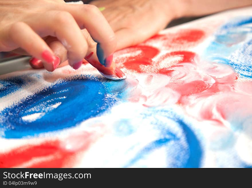 Figure fingers on the canvas. Bright colors. Figure fingers on the canvas. Bright colors.