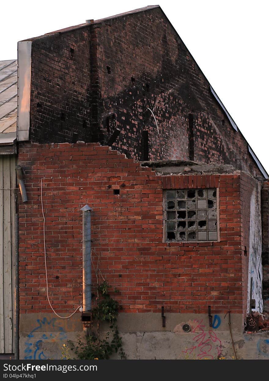 Abandoned and partly teared down brick house isolated with white background. Abandoned and partly teared down brick house isolated with white background