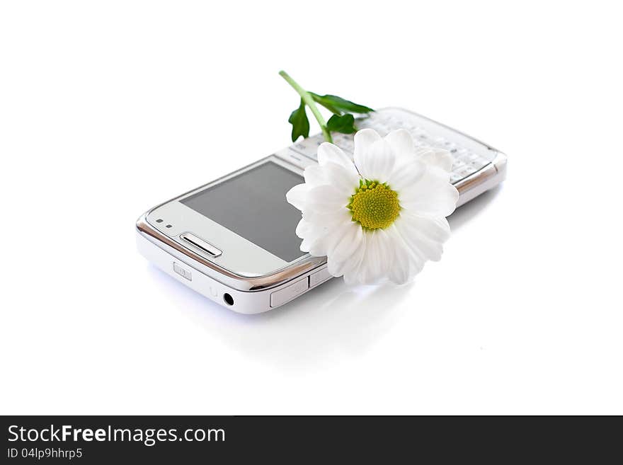 Cellphone and flower isolated on white