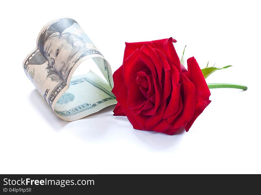 Dollar and rose isolated on white