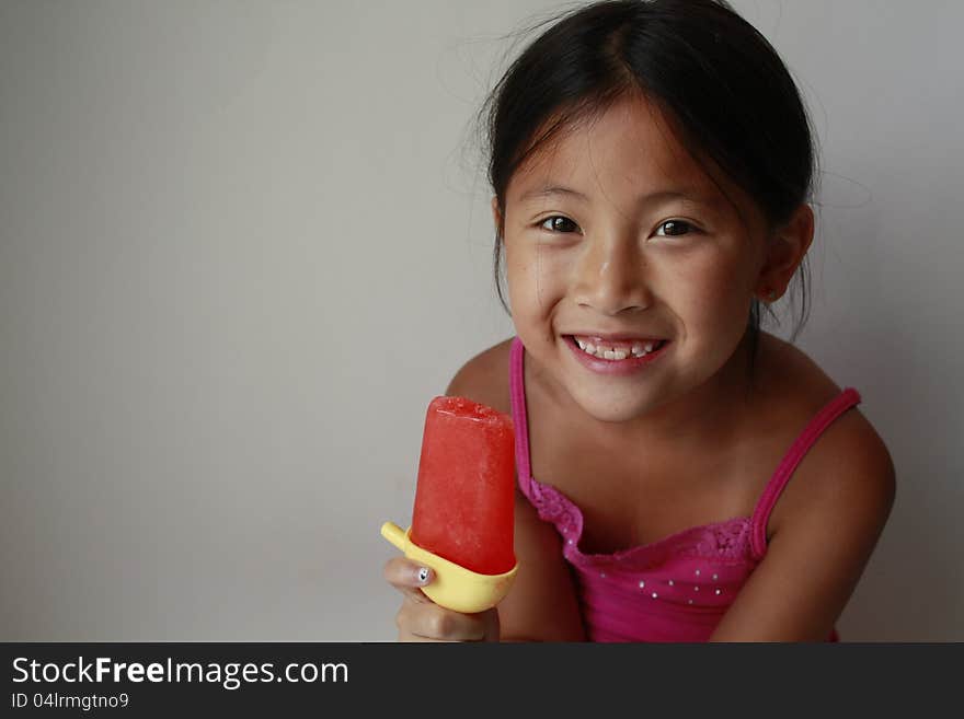 Chinese girl eating ice pop