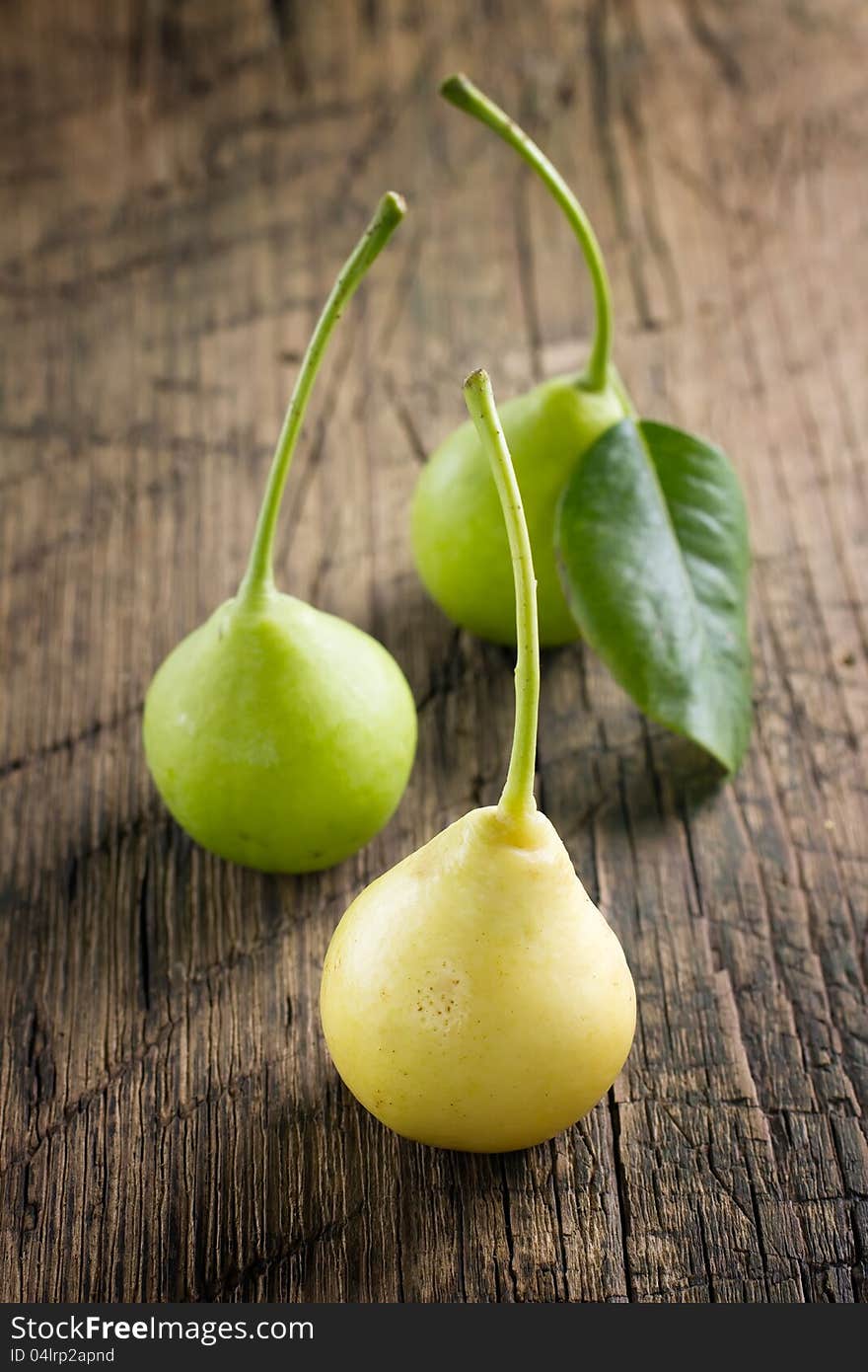 Pears on vintage wooden table