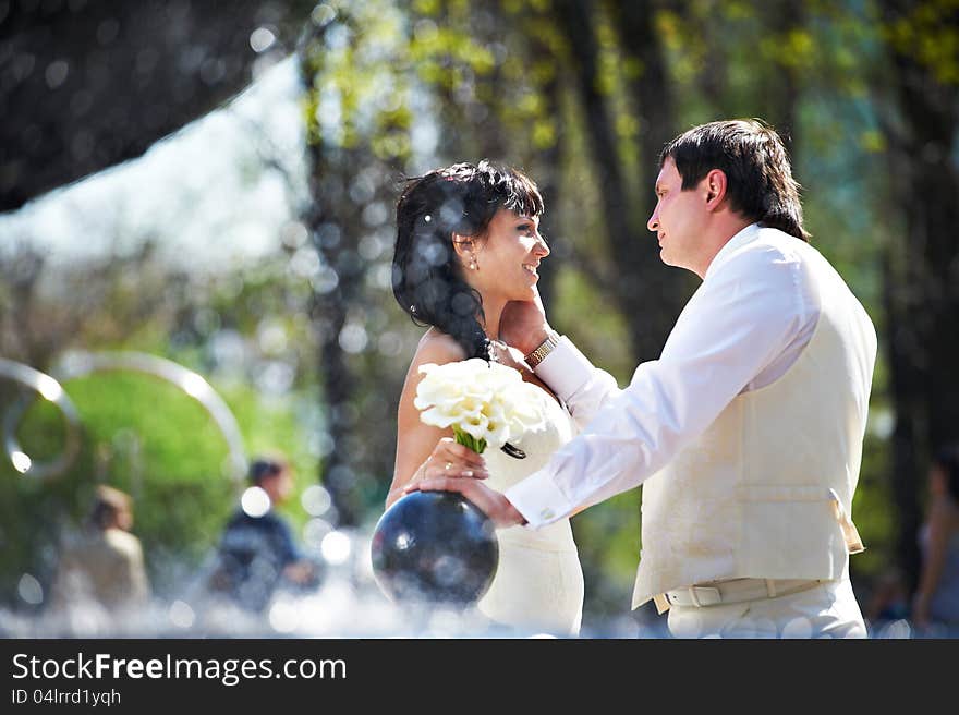 Happy Bride And Groom With Bouquet