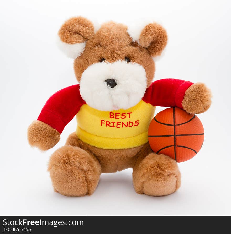 A brown teddy with basketball ball on a white background. A brown teddy with basketball ball on a white background