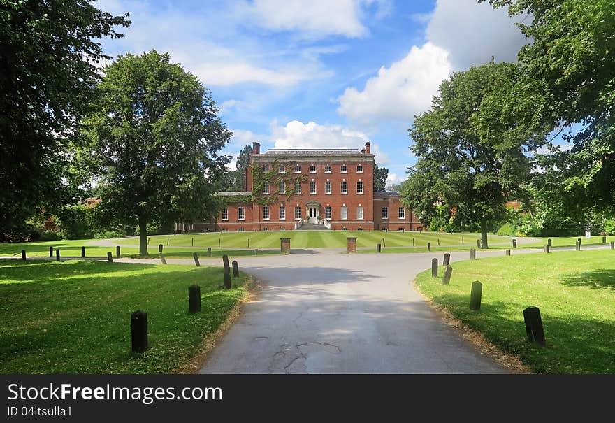 An English Stately Home with Mullion Windows viewed from the front Lawn. An English Stately Home with Mullion Windows viewed from the front Lawn