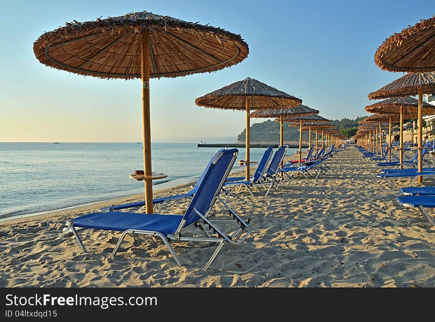 Beach umbrellas on Halkidiki beach in Greece, July, 2012. Beach umbrellas on Halkidiki beach in Greece, July, 2012