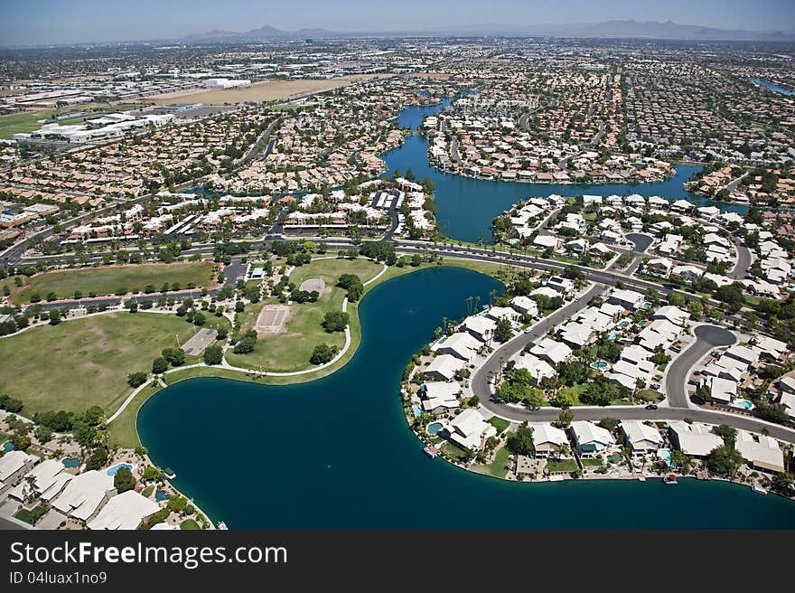 Aerial view of planned community with man made lake. Aerial view of planned community with man made lake