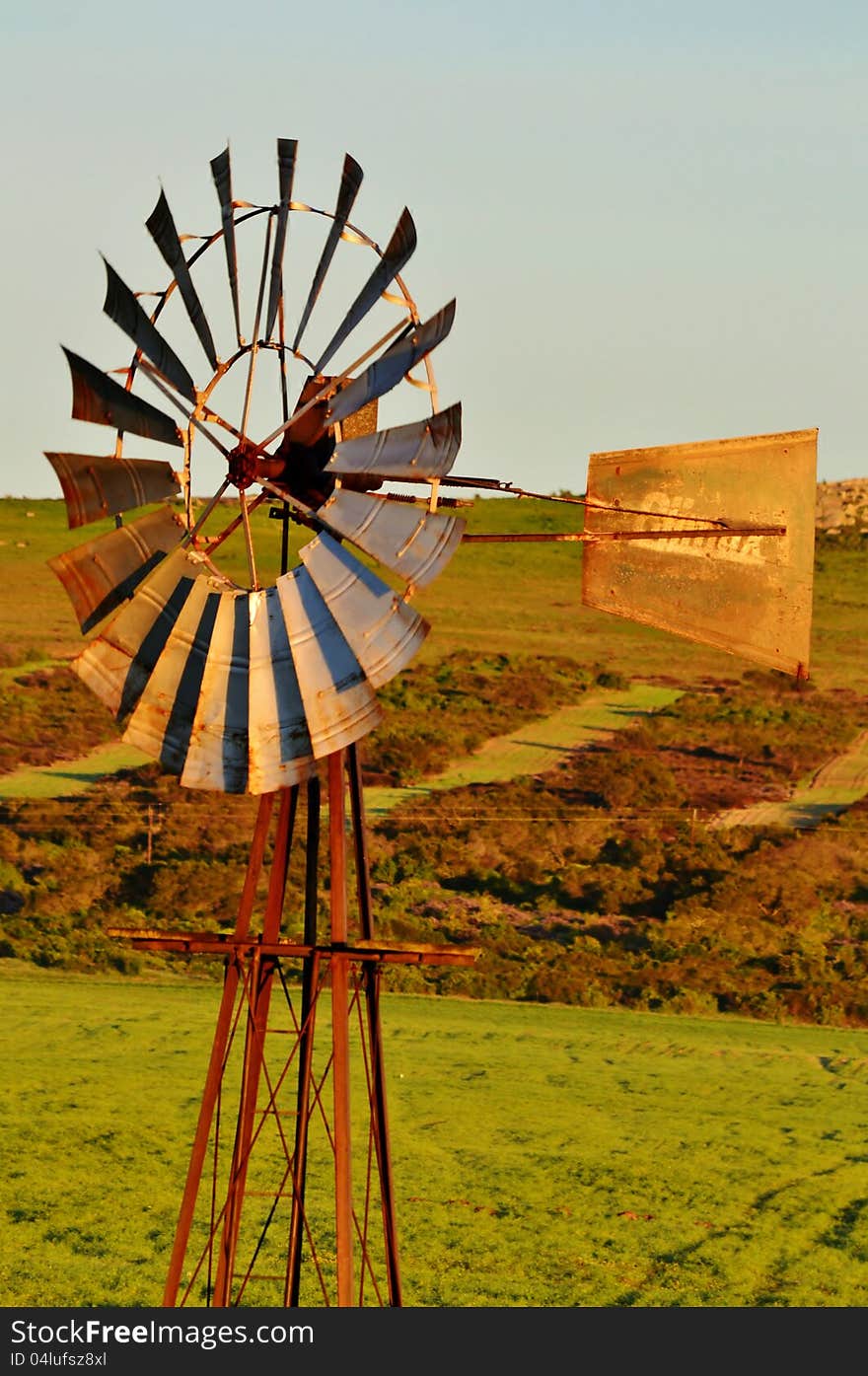 Landscape with windmill water pump on a farm westerncape south africa