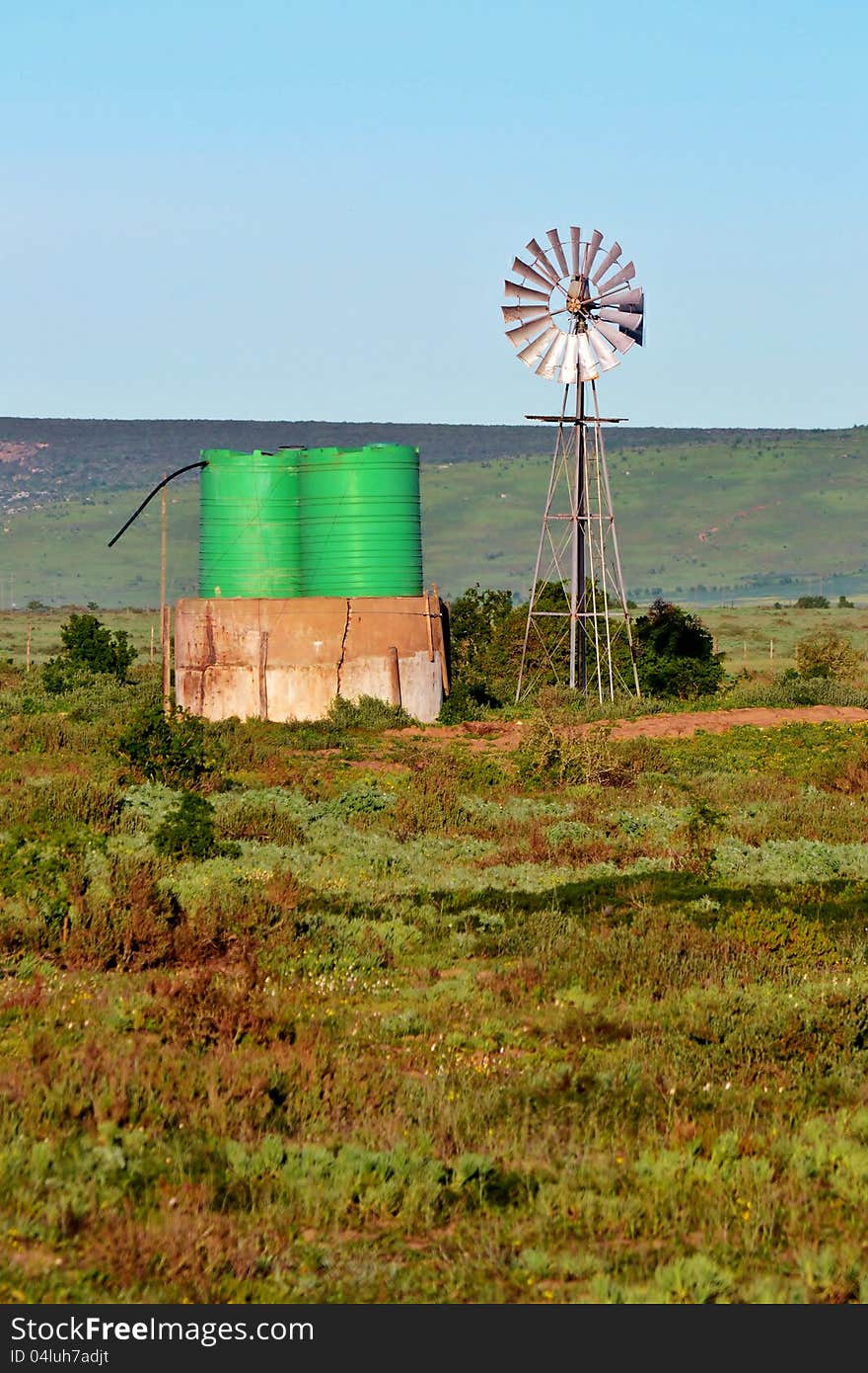 Landscape with windmill water pump on a farm westerncape south africa