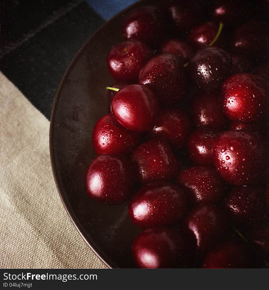 Heap of red fresh crerry on a plate. Heap of red fresh crerry on a plate