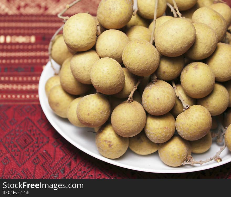 Longan fruit on white dish