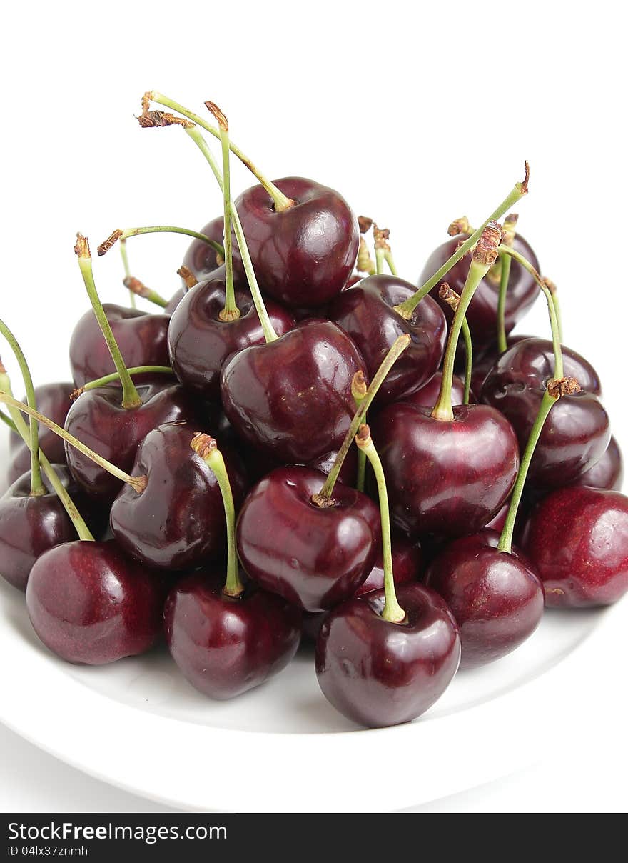 Red Cherries on White Dish Isolated