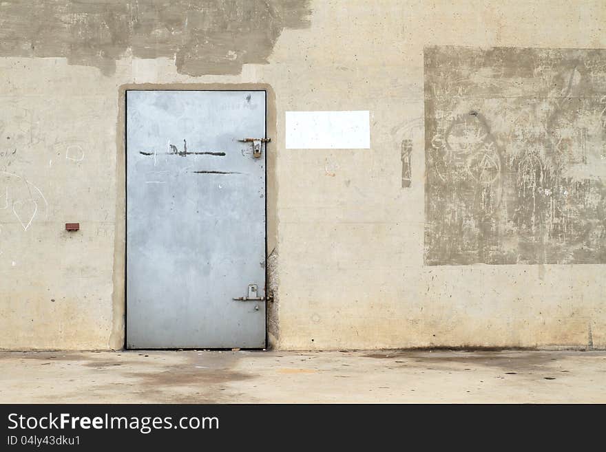 Concrete wall with metal door