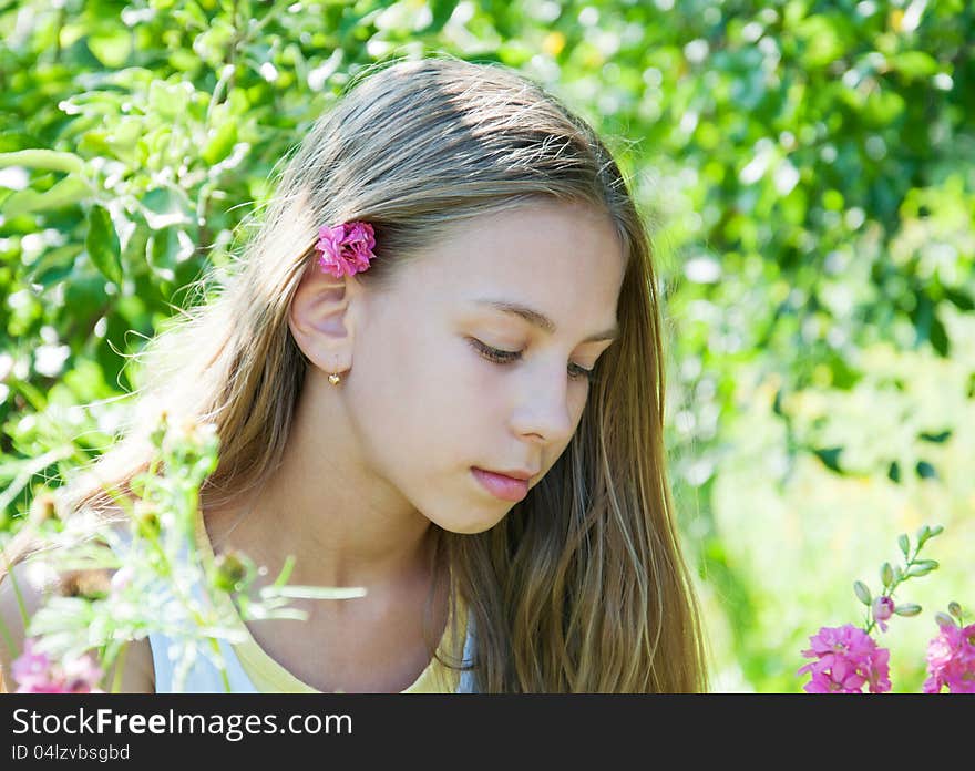 Portrait of beautiful l girl in the flower garden. Portrait of beautiful l girl in the flower garden