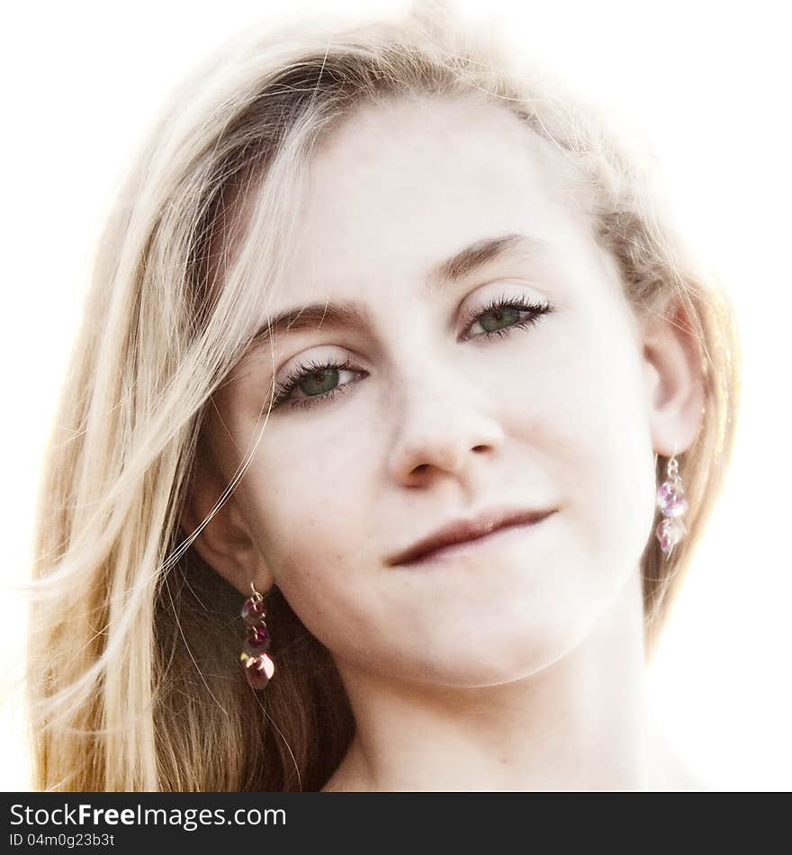 A softened high key portrait of a green-eyed young woman. A softened high key portrait of a green-eyed young woman.