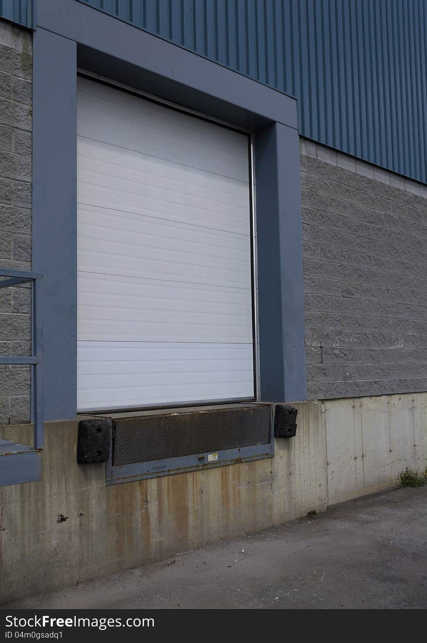 An empty loading dock with the door closed. An empty loading dock with the door closed