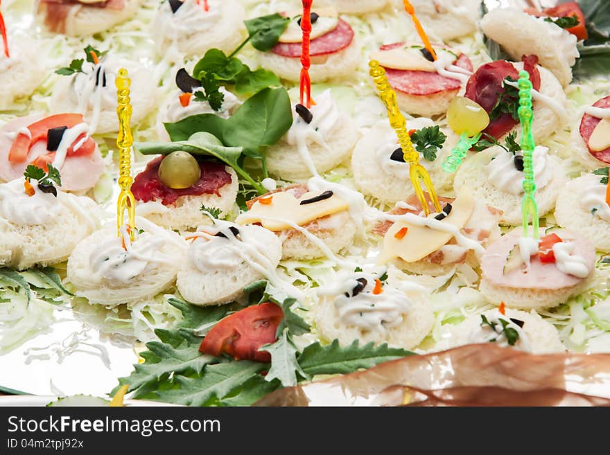 A plate full of different bread sticks.