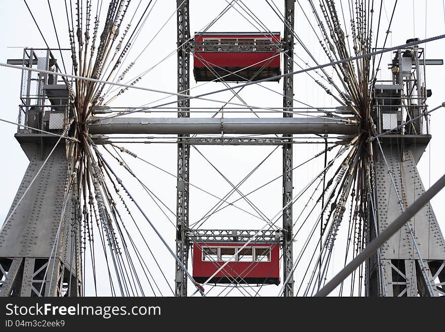 Closeup of famous Ferris wheel against blue sky with clouds in Prater Park, Vienna, Austria