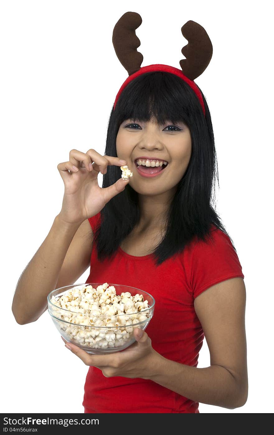 Santa woman eating popcorn isolated over white background. Santa woman eating popcorn isolated over white background