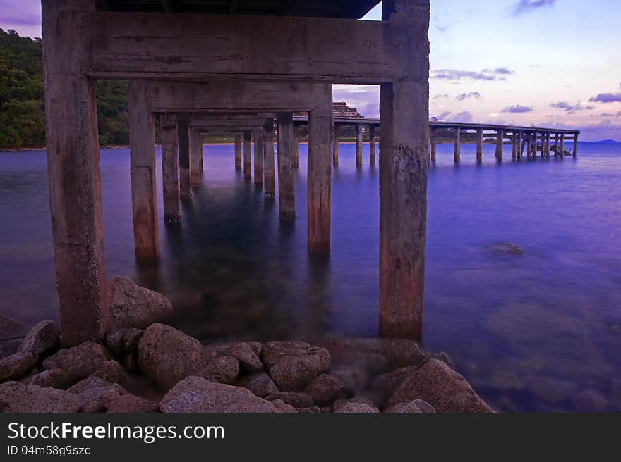 Wooden bridge across to the resort in Rayong, Thailand. Wooden bridge across to the resort in Rayong, Thailand.