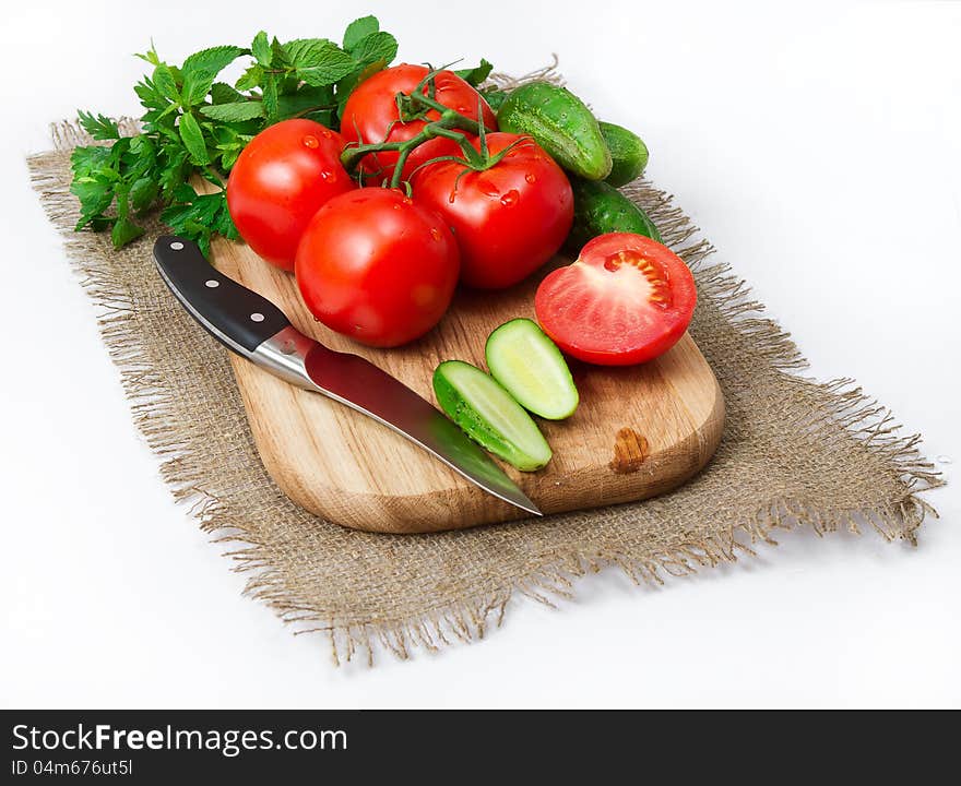 Tomatoes And Cucumbers On The Board