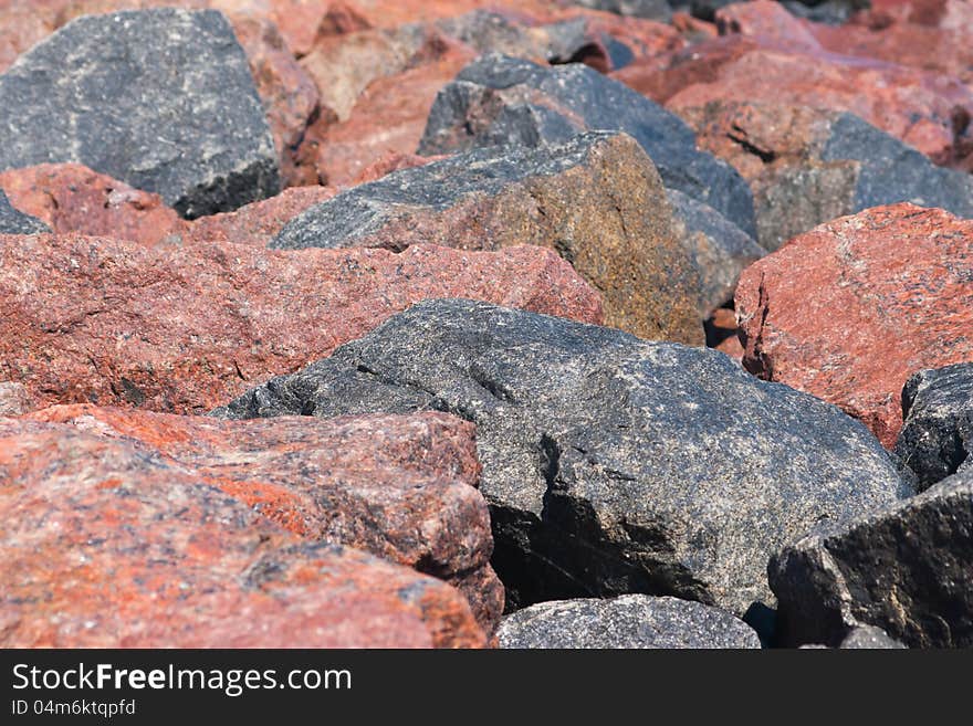 Weathered rubble granite stone background. Weathered rubble granite stone background