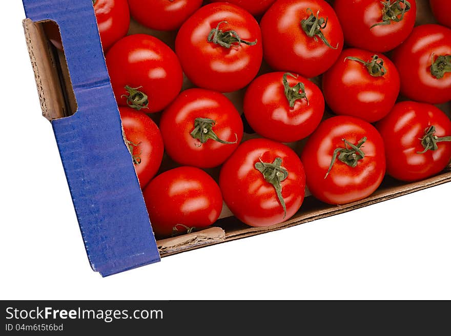 Tasty tomatoes in a box isolated on white. Tasty tomatoes in a box isolated on white