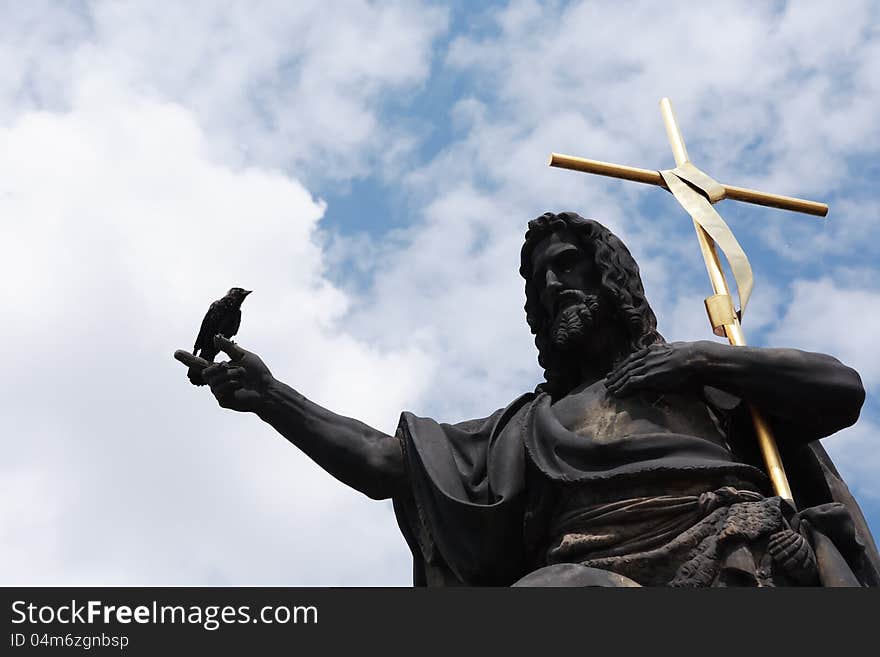 Saint John The Baptist statue with bird sitting on his hand. Saint John The Baptist statue with bird sitting on his hand