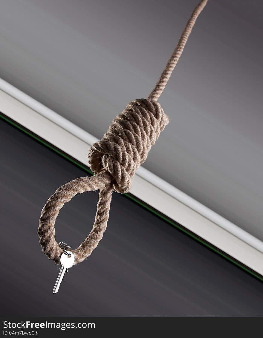 House keys haging on a hangman noose. House keys haging on a hangman noose