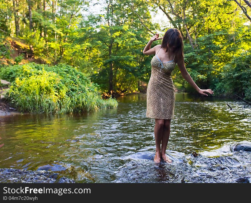 Beautiful girl with long hair in river. Beautiful girl with long hair in river